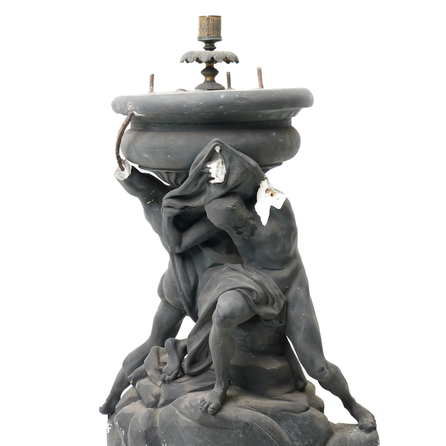 Neoclassical 19th century plaster pedestal, the base cast as two straining Atlantes on a naturalistic rocky base, unmarked, excluding fittings H65cm; together with a set of three plaster figures, cast as Egyptian ladies in headdresses and draped in cloth, by John Dominic Giannelli (1775-1841), the reverse with hieroglyphic decoration, inscribed 'Published as the Act Directed By J D Giannelli 1805', possibly corresponding attachments for the aforementioned pedestal, H62cm 
Provenance: property of a Nobleman