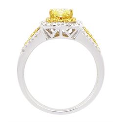 18ct white gold diamond heart cluster ring, principal heart cut fancy yellow diamond of approx 0.25 carat, surrounded by two halos of fancy yellow and white diamonds and split diamond set shoulders, Birmingham 2008, total diamond weight approx 0.50 carat