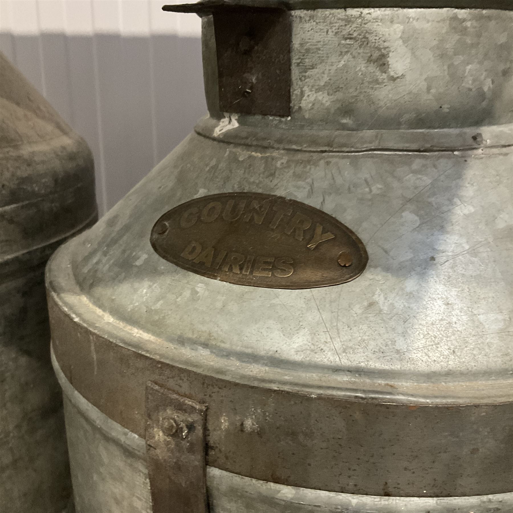 Pair of aluminium vintage milk churns and metal scale - THIS LOT IS TO BE COLLECTED BY APPOINTMENT FROM DUGGLEBY STORAGE, GREAT HILL, EASTFIELD, SCARBOROUGH, YO11 3TX
