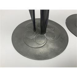 Pair of Solkets English pewter candlesticks, the bud shaped sockets raised upon three angular fin supports and a slightly domed circular base with cast stylised foliate decoration, H23cm
