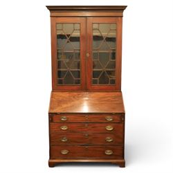 George III mahogany bureau bookcase, with projecting cornice top with dentil detail, astragal glazed cabinet enclosing fixed shelves, the lower section with fall front writing surface, fitted interior above four graduated drawers, raised on bracket feet