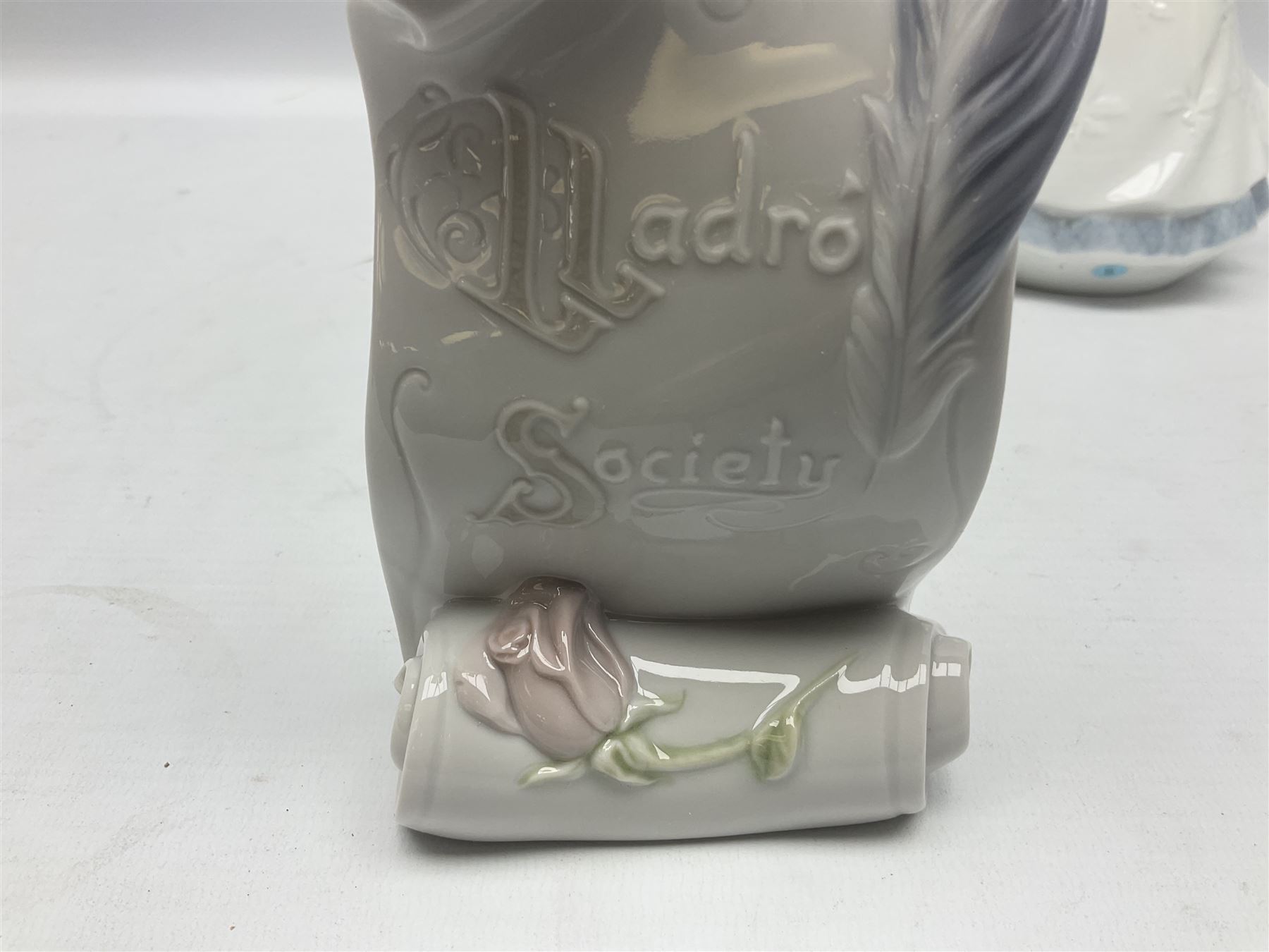 Three Lladro figures, comprising Dear Santa no 6166, Angelic Melody 1993 no 5963 and Seraphs Head no2 no 4885, together with Lladro plaque Love Brings Us Together no 7677, all with original boxes, largest example H18cm