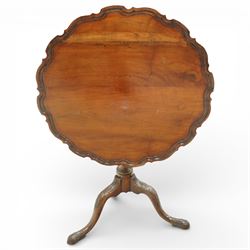Georgian mahogany pie crust occasional table, the circular dished top with scalloped and moulded edge, raised on a turned pedestal with three cabriole supports terminating in pad feet