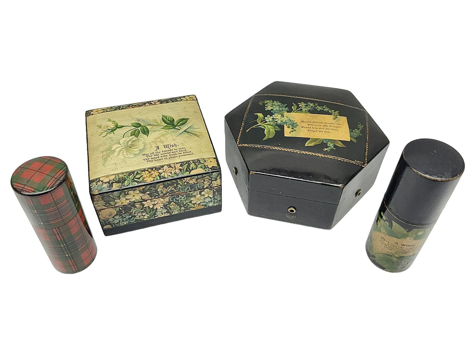Mauchline ware black lacquered octagonal bobbin box, the hinged cover with forget-me-not floral decoration and sentimental verse, opening to reveal six bobbin holders and retail label for Clark & Co, together with a Mauchline ware sewing box, with floral decoration throughout and verse to hinged cover, a similar black lacquered needle holder and a Mauchline Tartan ware needle holder, largest diameter D11.5cm