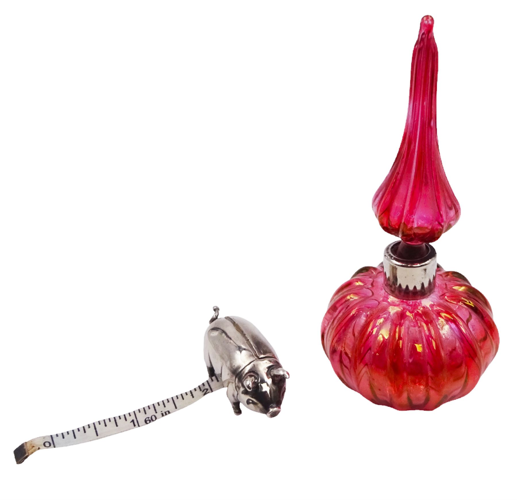 Modern novelty silver tape measure, in the form of a pig, hallmarked CME Jewellery Ltd, together with a silver mounted pink glass scent bottle, signed H. White to base, with silver collar hallmarked Laurence R Watson & Co, Birmingham 1996, scent bottle H12cm