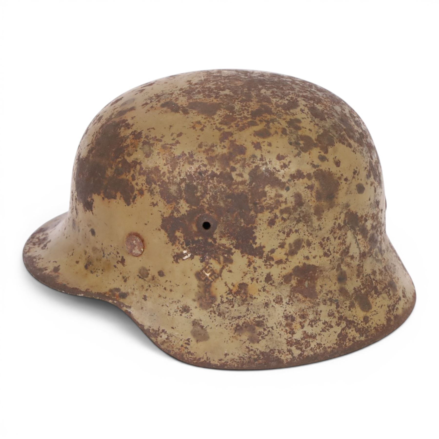 WWII German Third Reich M1940 helmet, with desert camouflage, the left inner brim stamped SE64, the back inner brim stamped 506, with leather eight tongue liner, together with German M34 helmet