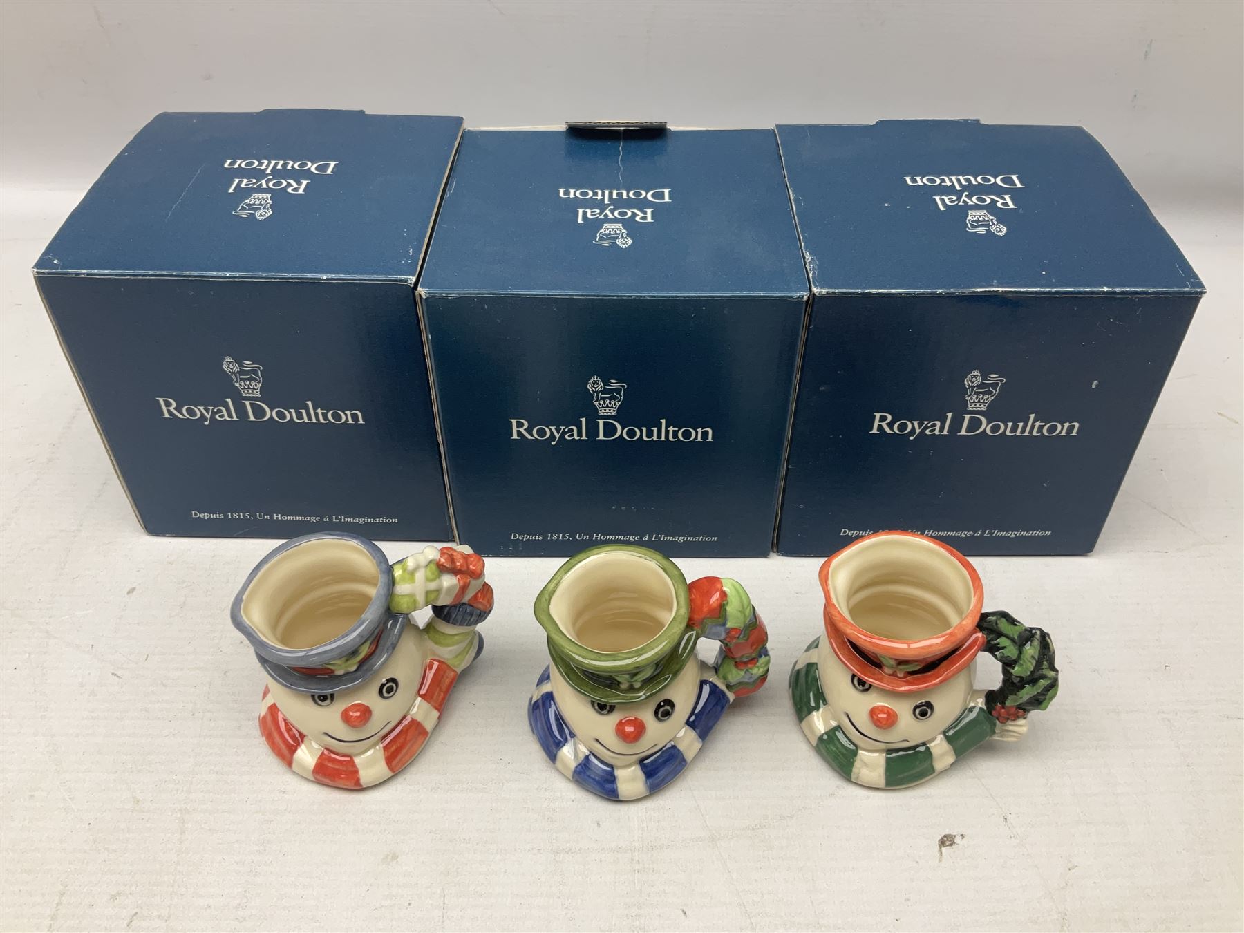 Three Royal Doulton The Mickey Mouse Collection figurines comprising Mickey Mouse MM1, Minnie Mouse MM2, and Goofy MM5, together withe three Royal Doulton limited edition miniature snowman character jugs comprising Christmas Stocking Snowman D7124, Christmas Cracker Snowman D7158 and Snowman D7062, all with original boxes 