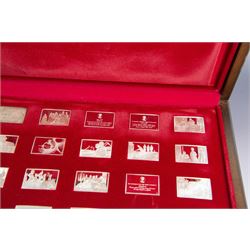 Elizabeth Our Queen silver ingots collection, twenty-five rectangular ingots each decorated in relief with a Royal scene, hallmarked John Pinches Ltd, London 1976, in wooden presentation case with information booklet