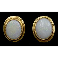 Pair of 9ct gold single stone oval opal stud earrings 