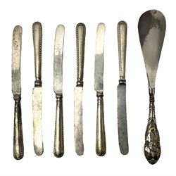 Set of six silver handled butter knives, and a silver handled shoehorn, all hallmarked, but hallmarks worn and indistinct