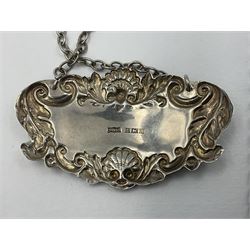 Five modern silver decanter labels, to include two sherry examples, embossed with scrolls and fruits, hallmarked W I Broadway & Co, Birmingham 1991 & 1997, a similar claret example, hallmarked S J Rose & Son, Birmingham 1973, and two plain shaped port and burgundy examples, hallmarked C Robathan & Son, Birmingham 1997 and A Haviland-Nye, London 1968