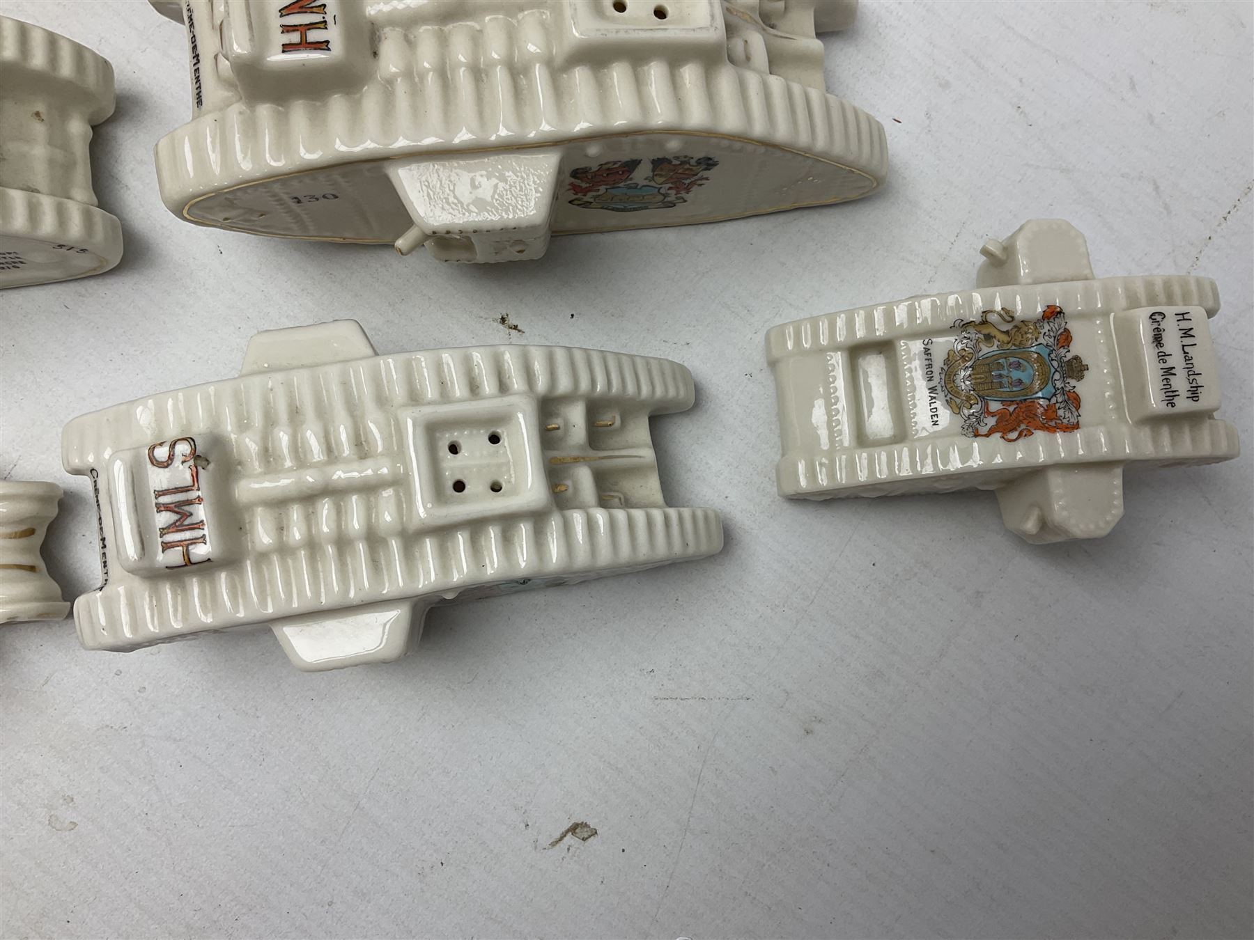 Twelve crested china models of WW1 tanks by Grafton, Arcadian and Carlton china etc with crests from Caistor Lincs, Saffron Walden, Paignton, Evesham etc  , together with a crested china model of the R.M.S Lusitania with New Brighton crest and a two-handled vase for 'The Forts Boxhill' (14)