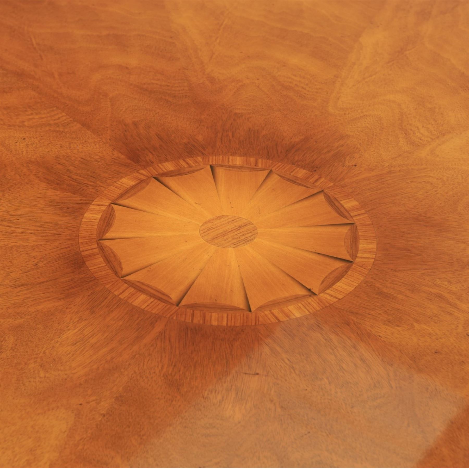 Bevan Funnell Reprodux - Regency design mahogany extending dining table, circular radial veneered top with central fan inlaid patera, on turned pedestal with four reeded downswept supports terminating in brass caps and castors, with six addtional leaves in a fitted storage case