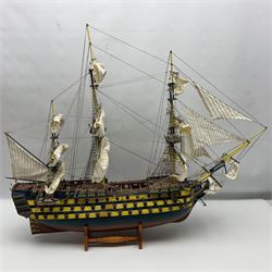 20th century scratch built wooden model of HMS Victory on wooden stand, H75cm, L95cm