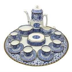 Late Victorian W T Copeland & Sons Primrose pattern coffee set for six, pattern no 2724, comprising coffee pot, milk jug, sugar bowl and six coffee cans and saucers, all upon a Lazy Susan, of circular form, with gilded rim and upon domed pedestal foot, with printed mark beneath, D44.5cm