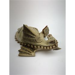 Zell Osbourne (British, Contemporary), Bookworm, a Studio Pottery figure modelled as a recumbent dragon with book, L21cm. 
