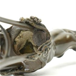 After D H Chiparus, an Art Deco style bronze modelled as a nude female figure seated upon a chair, H28cm.