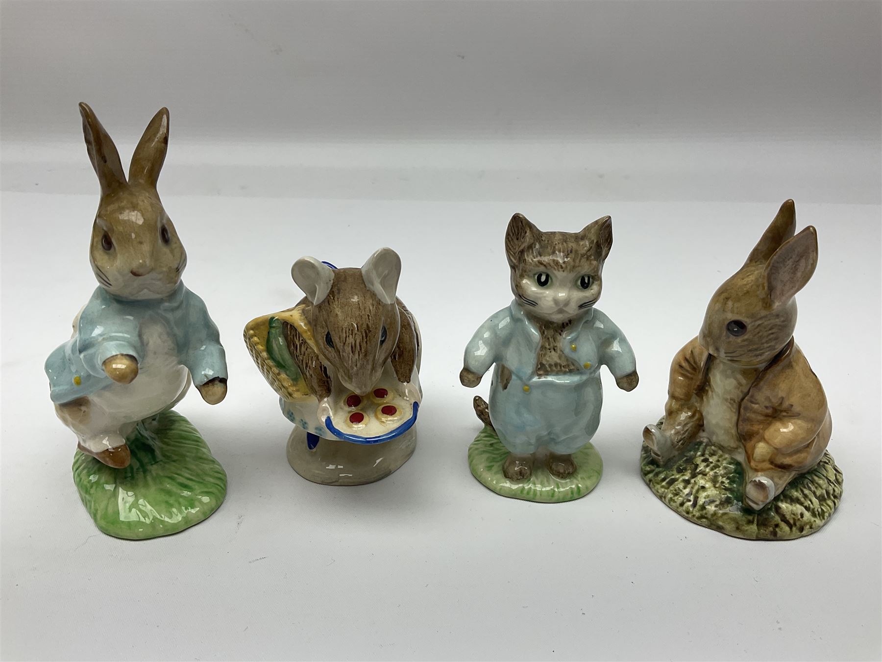 Seven Beswick Beatrix Potter figures, including Hunca Munca, Appley Dapply and Timmy Willie