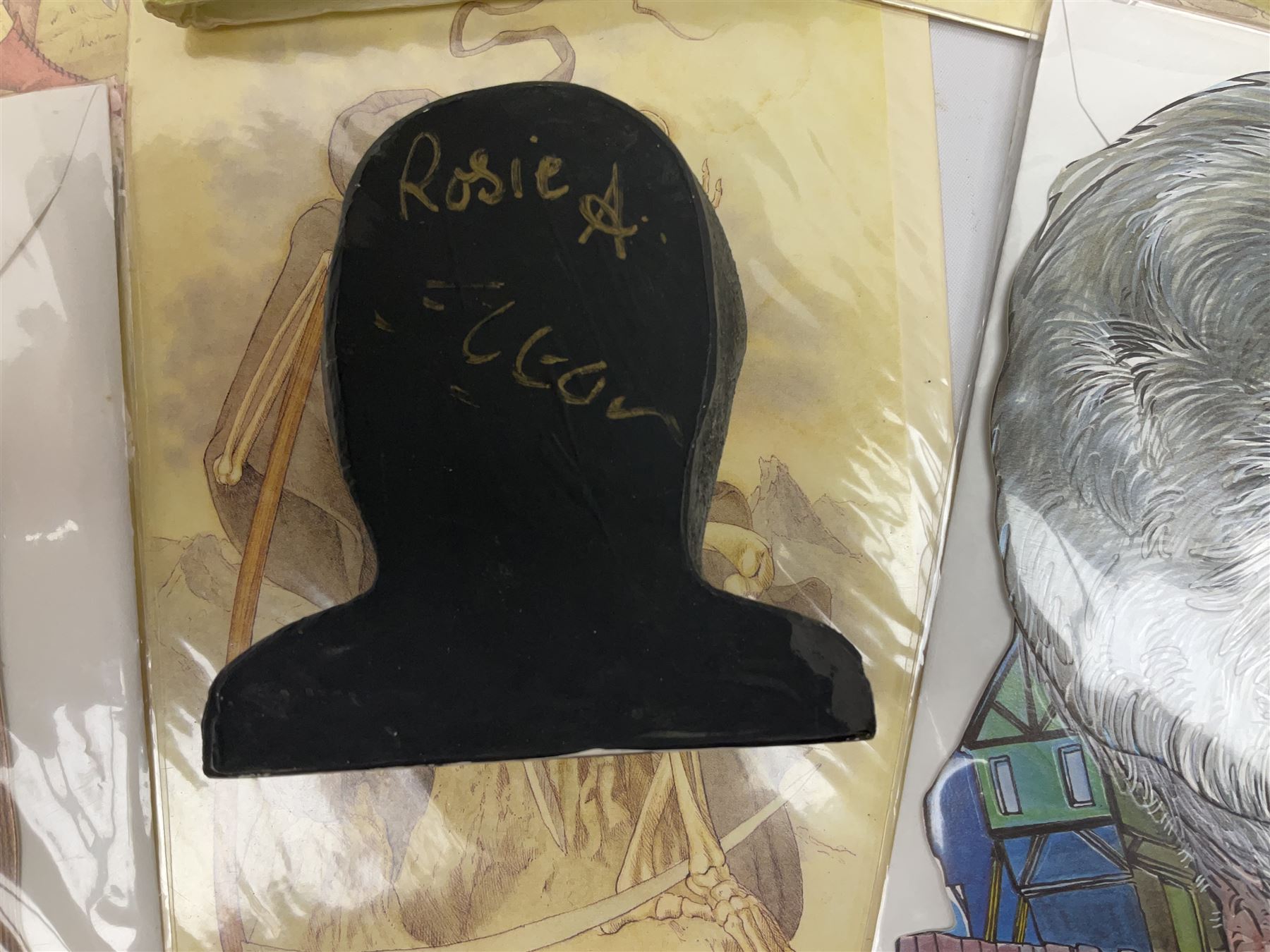 Terry Pratchett Discworld figures, designed by Clarecraft, comprising Death and Granny Weatherwax, DW90, Deathhead DWE8, Dried-frog pill box, boxed, DW63, Death as Beau Nidle, boxed, DW88, Agnes Nitt DW68, Detritus, DW22, Bonsai mountain, DW78, Volcanic bonsai mountain, boxed, DW79, Bonsai mountain valley, DW80, together with the Discworld mapp, and a collection of Terry Pratchett cards.  