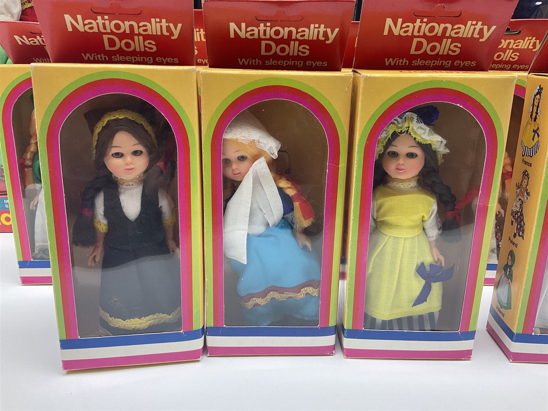 Four Mayfair Products Musical Dolls of Many Lands; original boxes and delivery boxes; and set of twelve Nationality Dolls with Sleeping Eyes; boxed (16)