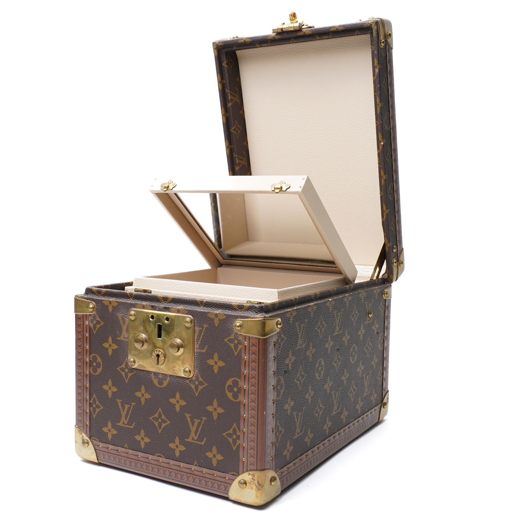 Late-20th century Louis Vuitton monogram Boîte Flacons vanity coffret, monogram canvas with lozine trim and brass mounts, single front brass lock stamped Louis Vuitton with key code 1247413, the interior fitted with leather flacon retaining loops and lift-out lidded tray with leather handle, label to interior printed Louis Vuitton Paris serial number 1045768, together with two keys stamped with matching serial numbers to the lock and luggage tag, circa late 1990s-early 2000s