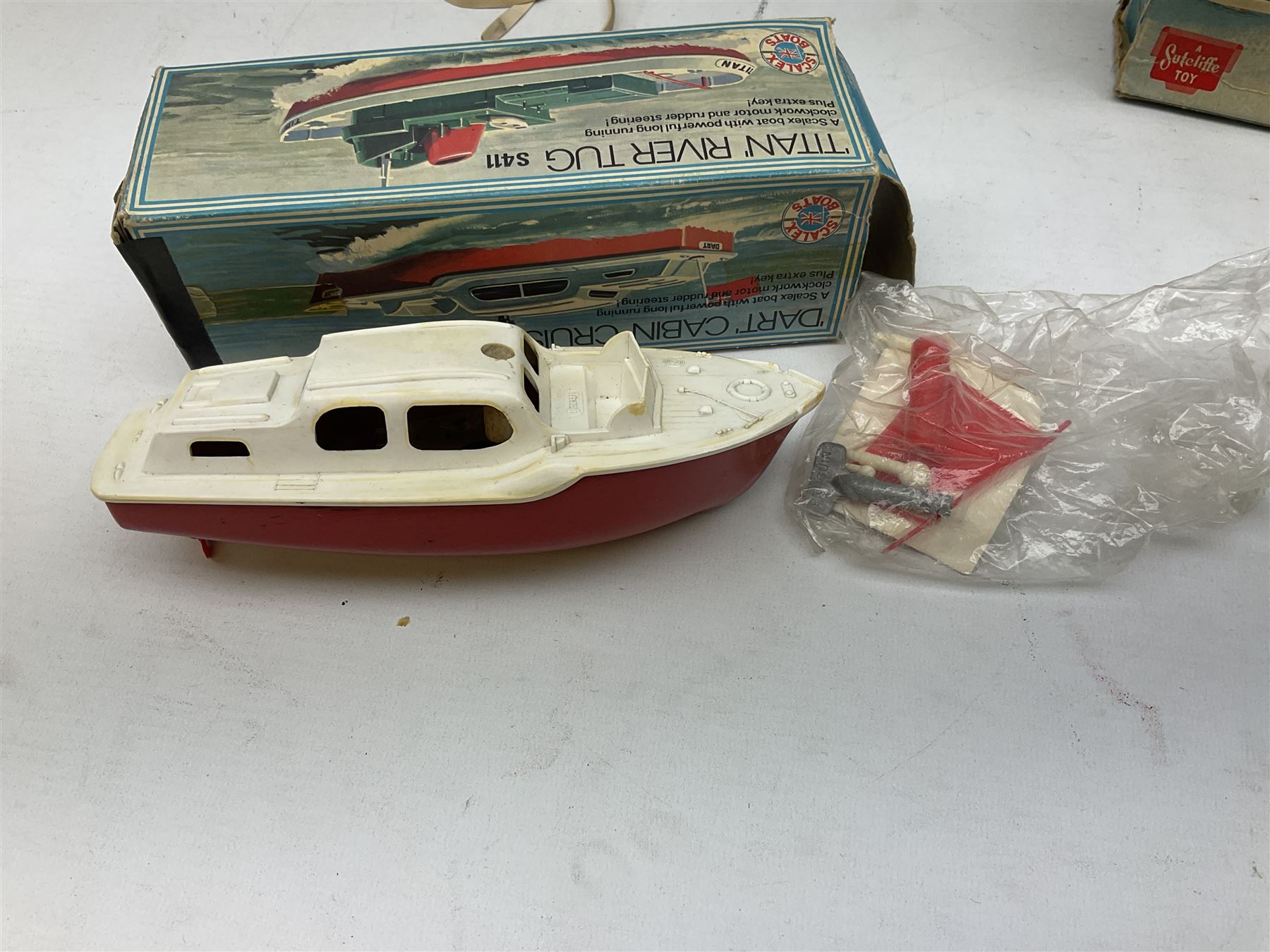 Five model boats - Sutcliffe clockwork Tiger Speedboat; boxed; Motor Sailor battery operated yacht; boxed; Waterline battery operated police launch; boxed; and Tri-ang Scalex 'Aberdeen' North Sea Drifter; boxed, with another similar unboxed (5)