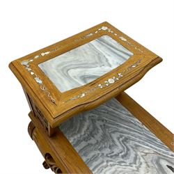 Pair of Chinese hardwood side or end tables, two moulded tiers with grey marble insets, inlaid with trailing foliate motifs in mother of pearl, with scrolling fretwork frieze rails, on cabriole supports with ball and claw feet united by plain stretchers 