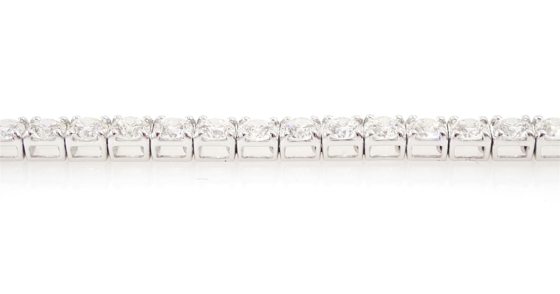 18ct white gold diamond bracelet, four claw set with fifty-one round brilliant cut diamonds, stamped 750, total diamond weight approx 6.35 carat