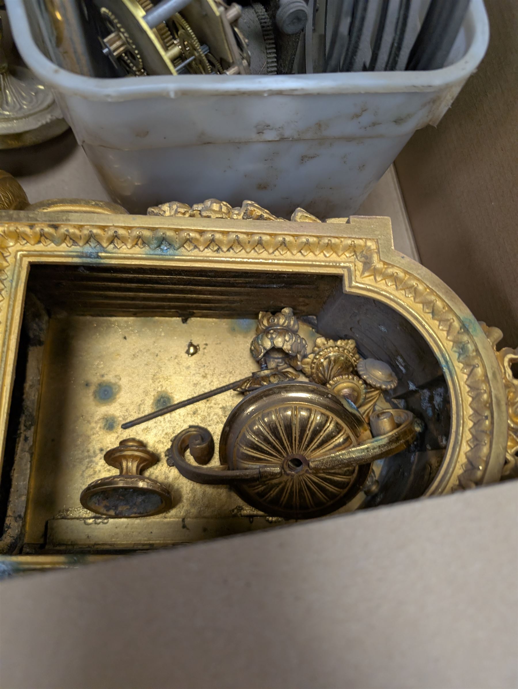 Collection of leather carriage clock cases, brass mantle clocks and parts, brass candlesticks etc, in two boxes