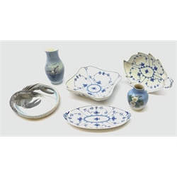  Three late 20th century Royal Copenhagen dishes in the Blue Fluted Plain pattern, together with two Royal Copenhagen vases, the larger decorated with birds, the smaller with flowers, and a Royal Copenhagen dish with moulded lobster detail, all with printed and hand painted marks beneath, larger vase H17.5cm, square dish with canted corners D20cm.  
