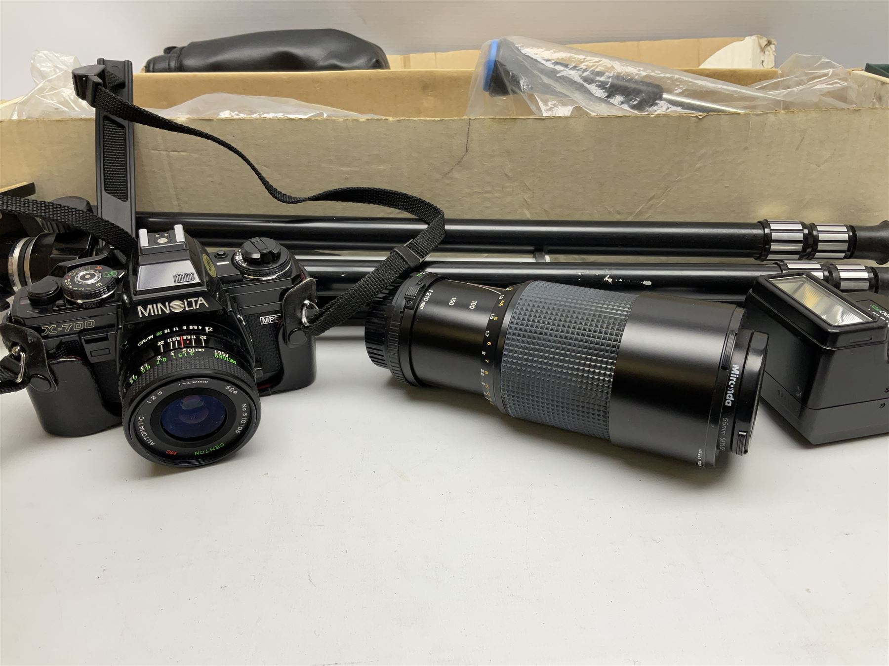 Minolta X-700 camera and lenses comprising Skylight 55mm lens and 135mm lens, Auto 280PX flash, together with other accessories to include tripod etc