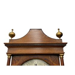 Kidd of Malton - late 18th century 30hr oak cased longcase clock, with a short pagoda pediment and gesso finials, square hood door with fan inlay to the corners flanked by turned pilasters with brass capitals, long trunk with conforming flat topped door on a rectangular plinth with applied shaped skirting, circular silvered dial with engraved decoration, Roman numerals and five minute Arabic’s, matching blued serpentine hands, dial pinned to a four pillar chain driven countwheel striking movement, striking the hours on a bell. With weight and pendulum.
The Kidd family of clockmakers are recorded as working in Malton (Yorks) from 1760-1807.
