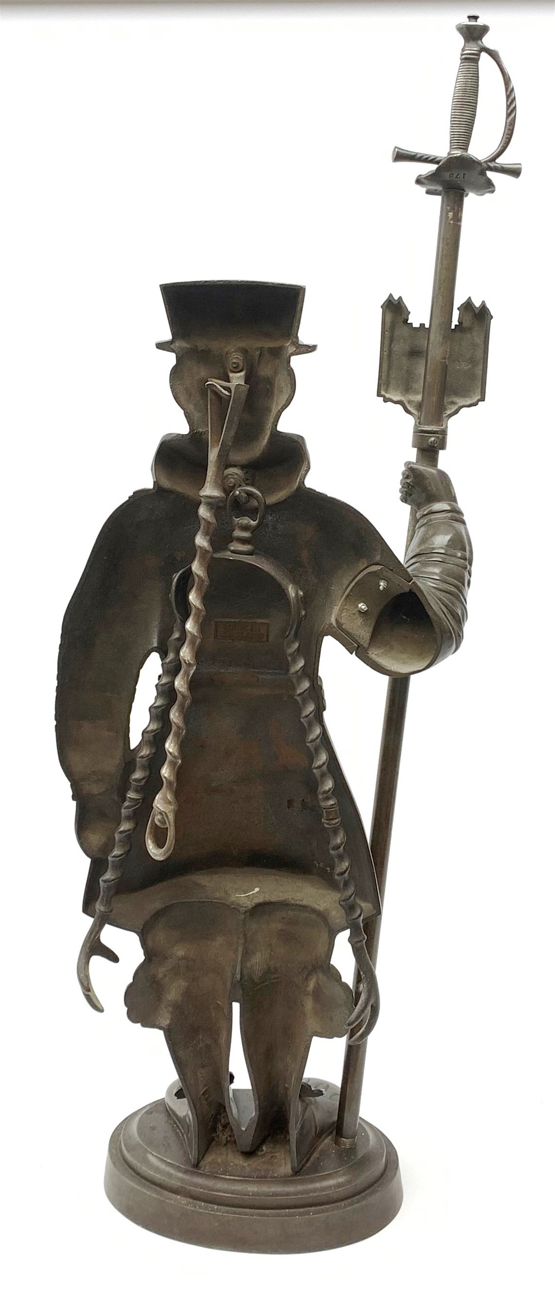 A cast iron figural companion set modelled as a Beefeater, H83cm. 