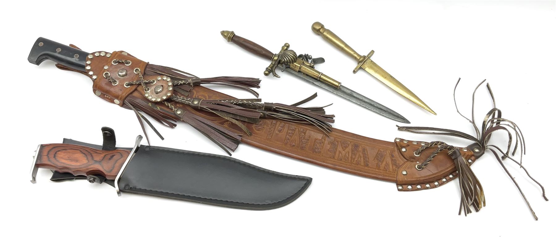 Guatemalan Collins & Co. reproduction machete with 61cm steel blade in tooled leather scabbard; modern bowie style knife, the 26cm pierced stainless steel blade with saw back and grained wooden grip in leather scabbard; and two reproduction daggers, one incorporating flintlock pistol (4)