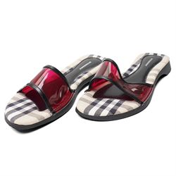 Christian Louboutin and Burberry - two pairs of designer shoes, comprising black leather Christian Louboutin low-top sneakers with black spike-studded toe caps and signature red soles, size 40, with dust bag, together with Burberry check canvas and red transparent strap sandals, size 39, with box and dust bag (2)