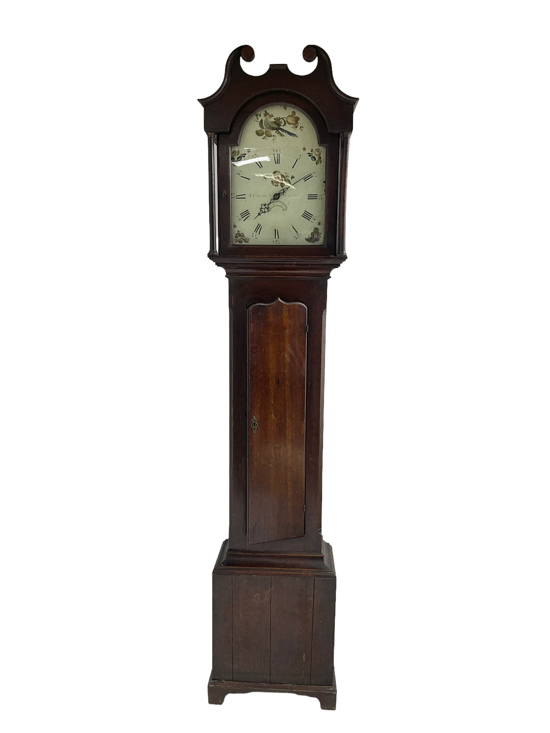 John Bancroft of Scarborough - oak cased thirty-hour longcase clock c1800, swans neck pediment with a recessed break arch door flanked by two pilasters with capitals, trunk with canted corners and long trunk door with a wavy top, rectangular plinth on bracket feet, painted dial with Roman numerals and five minute Arabic’s, matching steel hands and calendar aperture, floral spandrels and conforming artwork to the break arch, chain driven count wheel movement striking the hours on a cast bell. With pendulum and weight.