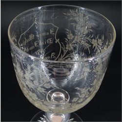 Late 19th century oversized glass goblet, the bowl engraved with cartouche containing dedication 'Jams Michie Died Jan 6th 1871 Aged 26 Years', surrounded by foliate detail, upon a hollow knopped stem containing a silver Victorian 1861 threepence and circular foot with star cut base, H19.5cm