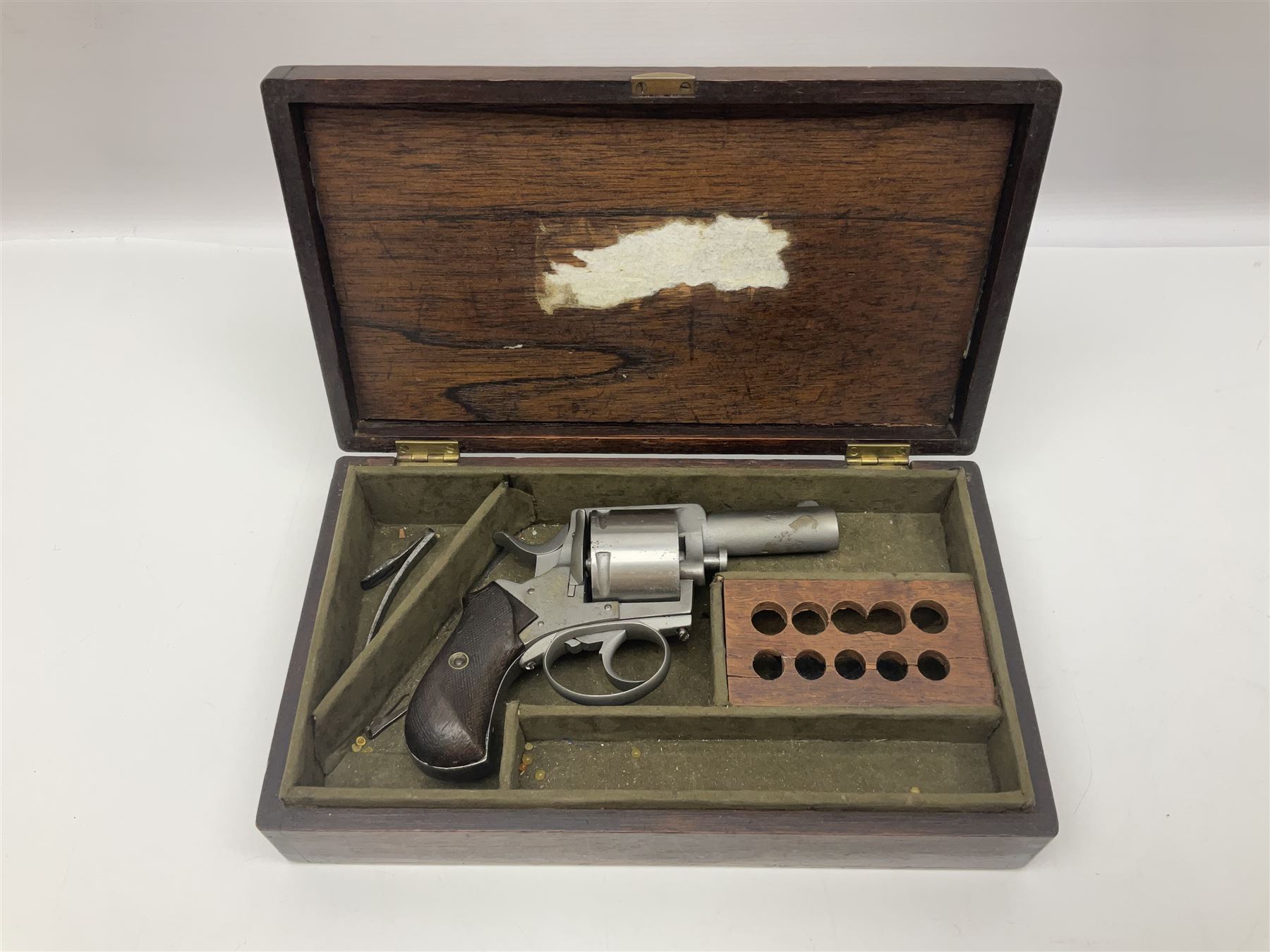 The major parts only of a British Bull-Dog .500 Boxer five-shot revolver comprising stripped down framework, cylinder, trigger with guard, functioning hammer and two-piece chequered grip; retailed by G. Goth Buenos Ayres; Belgian proof marks; L19.5cm overall; in fitted mahogany case 