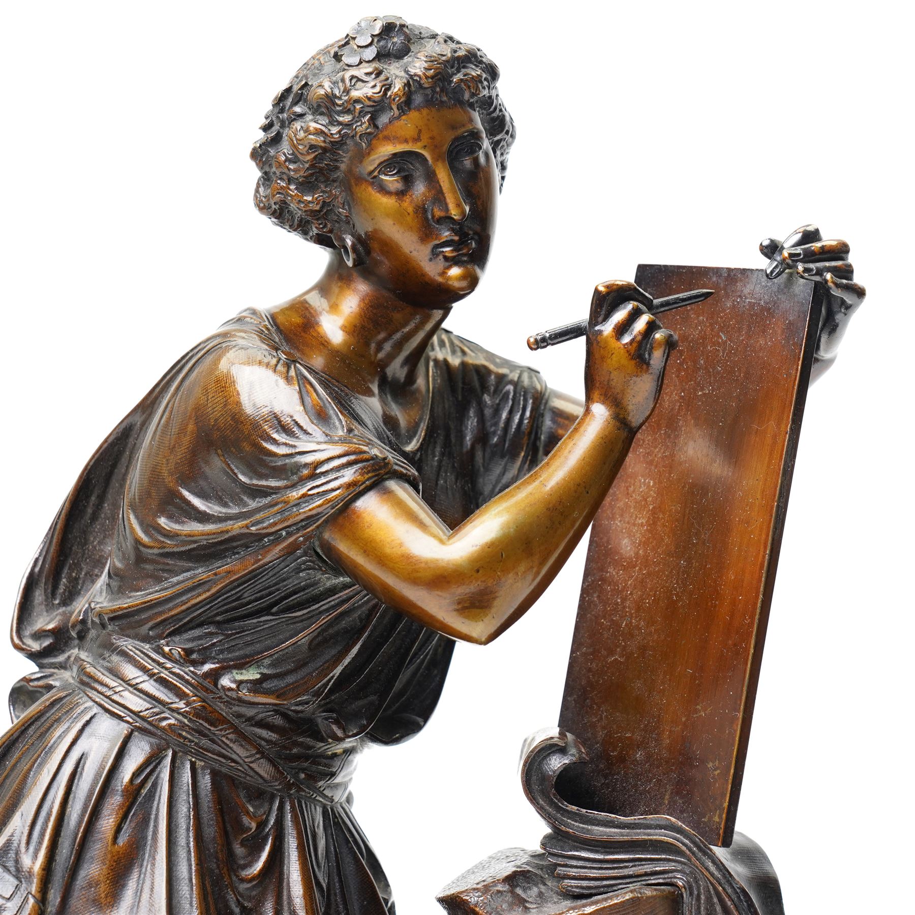 After the Antique - a pair of important 19th-century patinated bronze allegorical figures representing Calliope and Melpomene, the Muses of Epic Poetry and Tragic Drama, each modelled as a classically draped female figure standing beside a pedestal with climbing ivy, Calliope depicted writing upon a tablet, embodying poetic inspiration; Melpomene shown in contemplative pose and wearing a serpent bracelet, emblematic of wisdom, transformation and the inspired voice of drama, the pedestals inscribed respectively with the names of celebrated English poets and playwrights including Chaucer, Spenser, Milton, Pope, Cowper, Burns, Byron and Scott; the other with Shakespeare, Beaumont, Fletcher, Ben Jonson, Massinger, Congreve and Garrick, on integral square bases, each bearing incised or stamped foundry or model numbers to the underside, H47cm