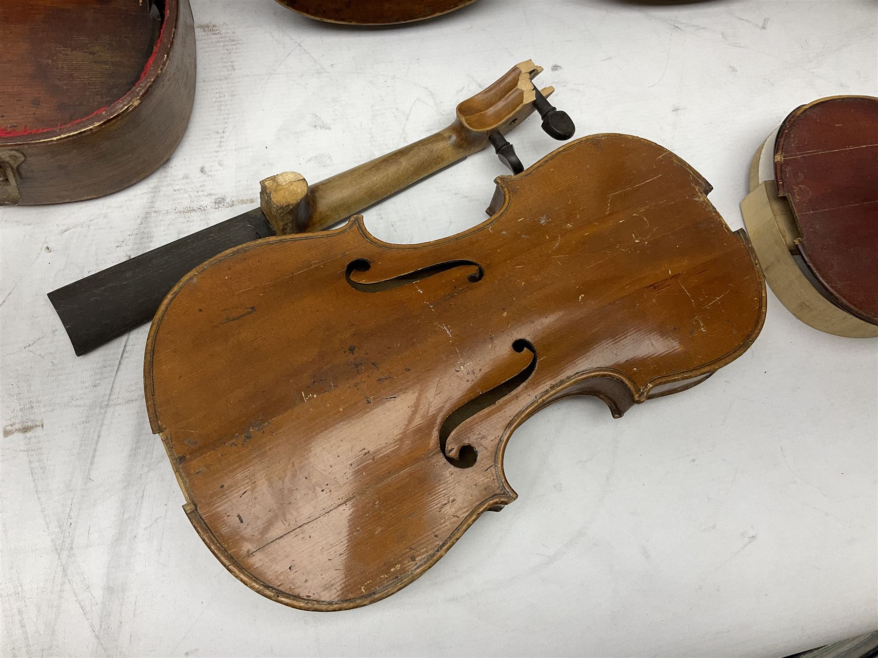 French violin for restoration with 36cm two-piece maple back and ribs and spruce top, bears label 'Lutherie Artistique M. Couturieux'; in wooden case; two modern three-quarter size violins in cases; and five violins for spares or repair