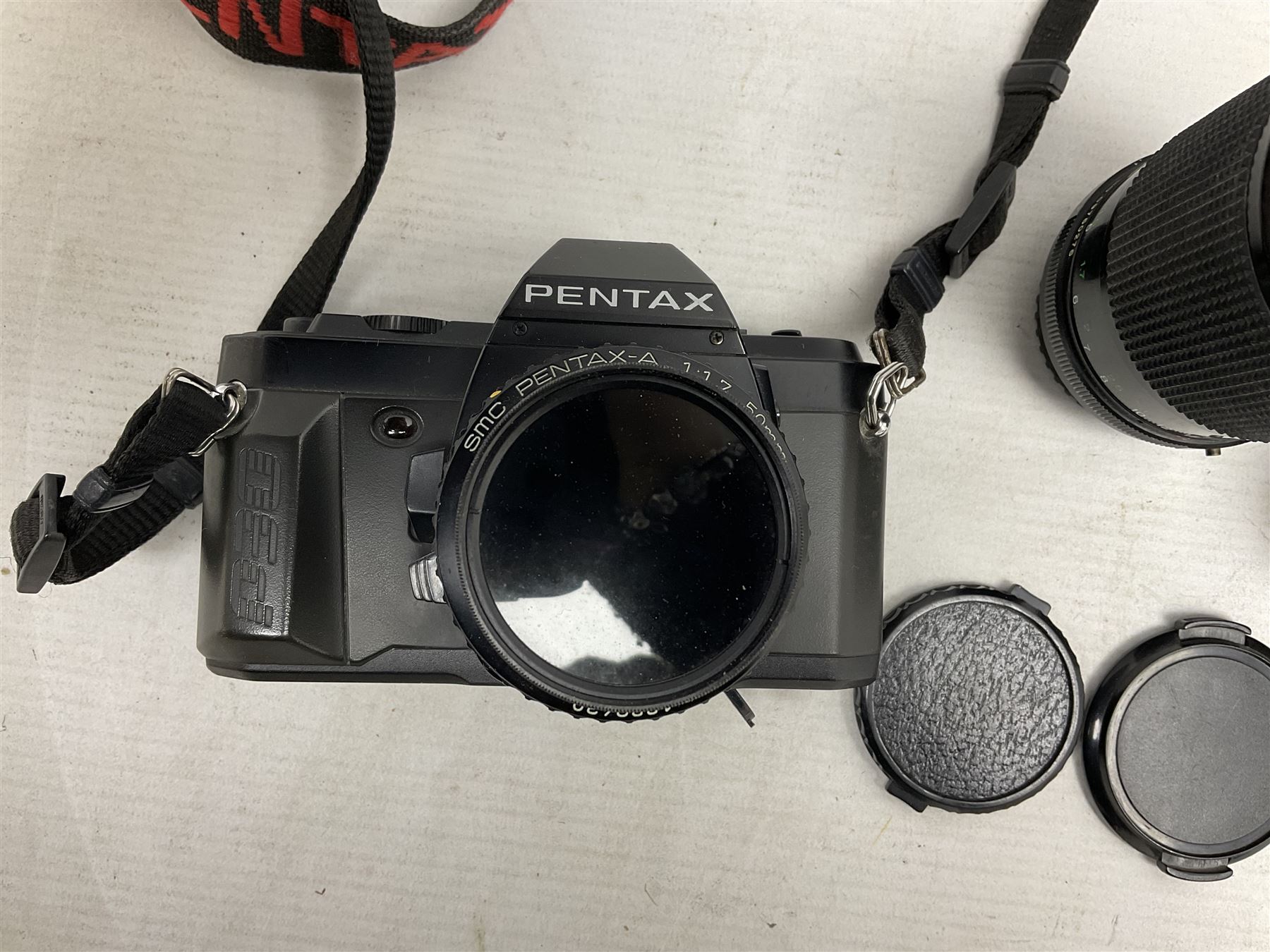 Pentax P30 SLR camera with SMC Pentax-A 1:1.7 50mm lens, Sigma Super-Wide II 1:2,8 lens and Vivitar 70-210mm lens