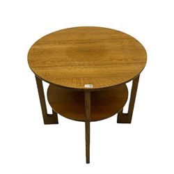 Early 20th century circular coffee table, angular supports joined by undertier
