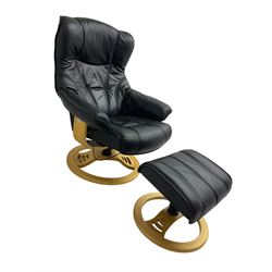 Anderssons of Sweden - mid-20th century design swivel armchair, upholstered black leather, raised on beech U-frame supports with circular base, together with matching footstool 