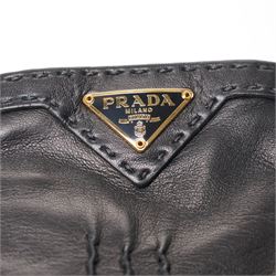Prada - pair of black lambskin leather gloves, with enamel gold-tone and black triangle logos and silk lined interior, unused with original box