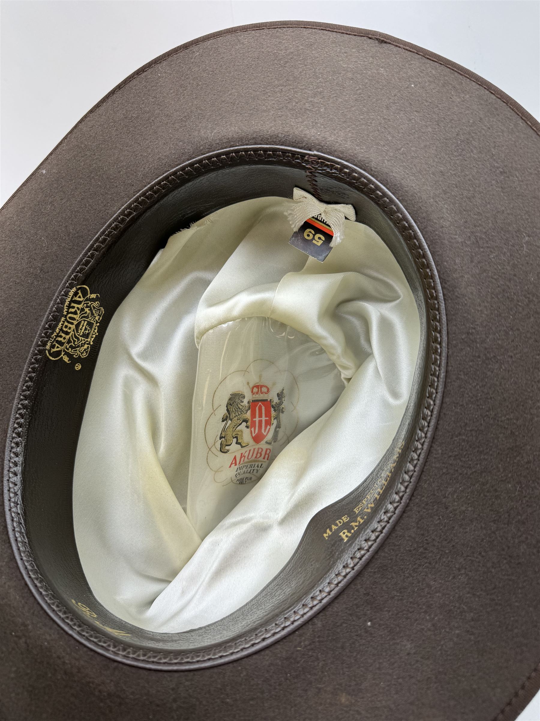 Akubra pure fur felt trilby hat, together with another trilby and two top hats, one by Woodrow and one by Dunn & Co