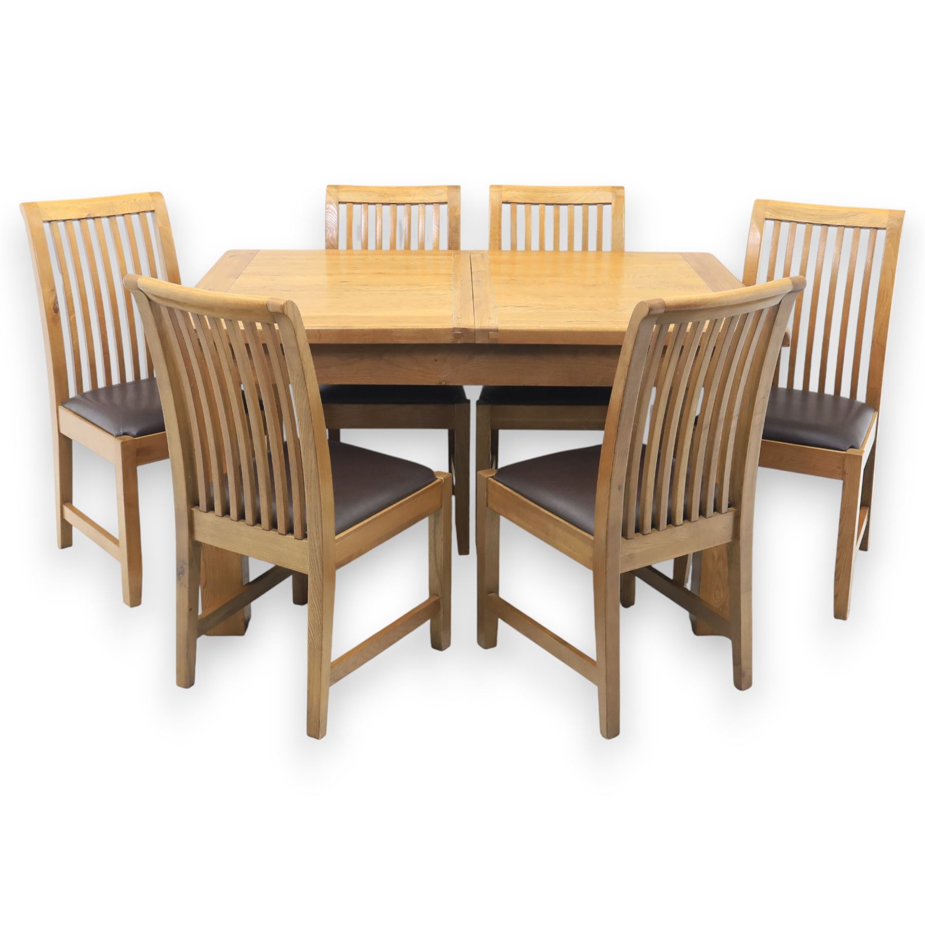 Contemporary oak extending dining table, moulded rectangular top with visible grain and inset extension leaf, pull out extending mechanism, standing on four square legs, accompanied by a set of high slat back chairs with upholstered brown faux leather seats and square tapering supports joined by stretchers