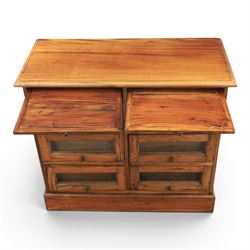 20th century Haberdashery style hardwood chest, two brushing slides, with six glass fronted drawers, blackened metal pulls, plinth base 