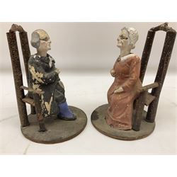 Pair of late 19th century, early 20th century  Folk Art nodding figures, modelled as a seated elderly lady and gentleman each seated on a wooden chair, H17cm