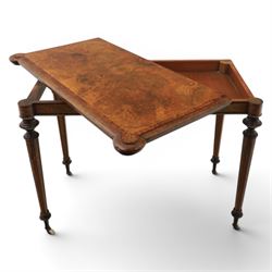 Victorian walnut card table, hinged rectangular moulded top with rounded corners and figured veneers, revealing a green baized lined interior, plain frieze with beaded lower edge, raised on ring turned tapering supports terminating in ceramic castors