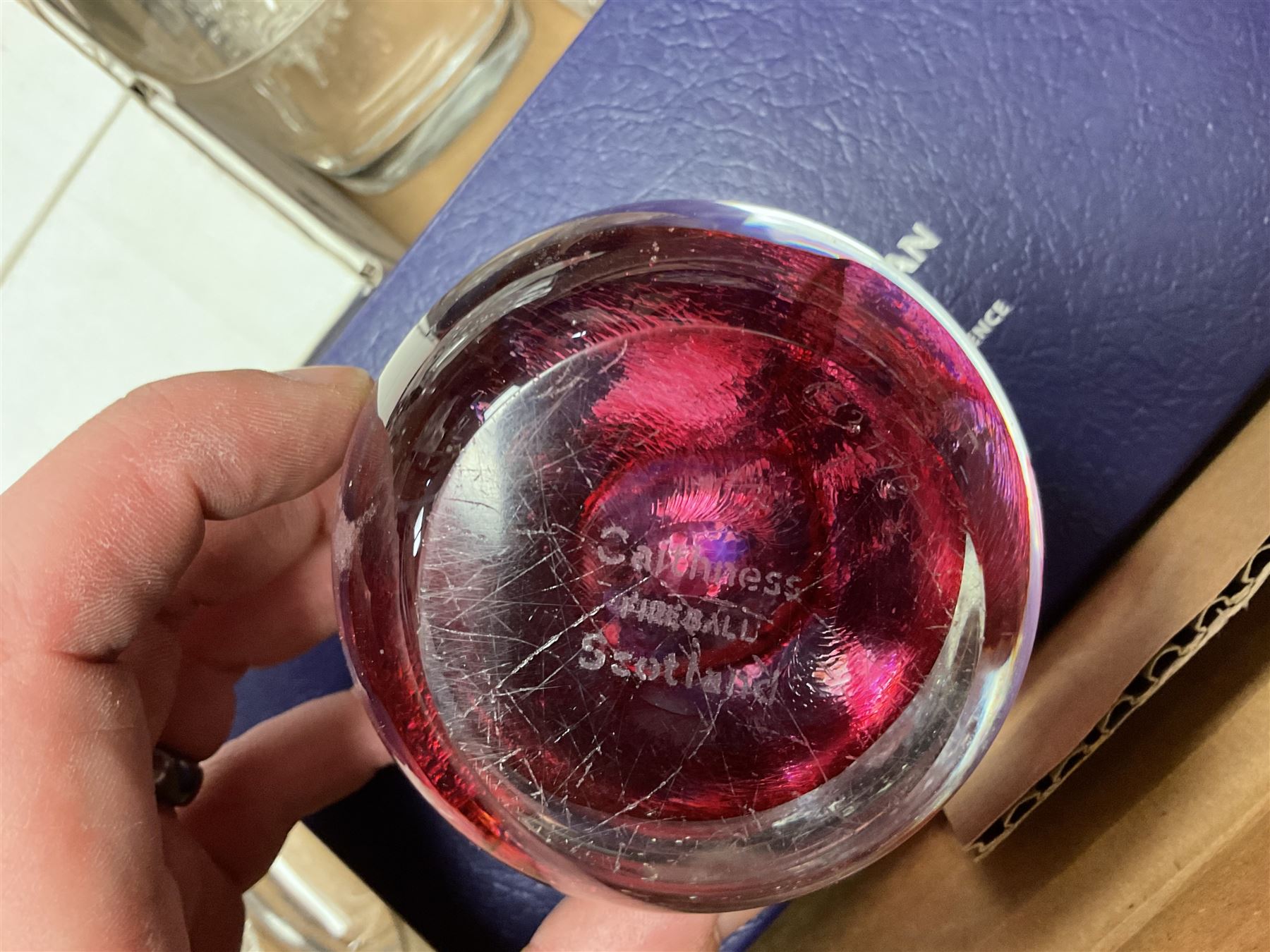 Caithness 'Fireball' paperweight, together with four cased Tyrone Crystal glasses, glass oil lamp, three glass decanters etc, in two boxes